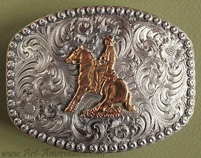 Cette boucle de ceinture américaine western country représente une scène d'équitation western. Ce bijou western made in USA est signé Wage.