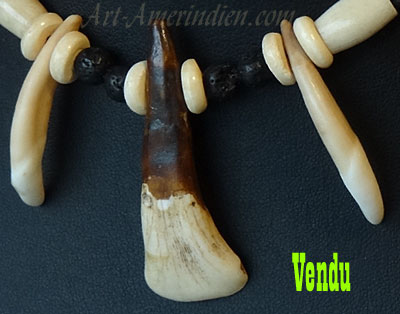 Indian choker necklace made out of buffalo bone beads, coyote teeth, buffalo tooth