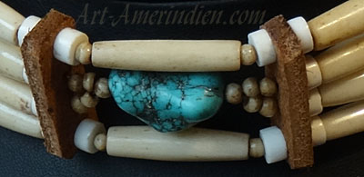 Indian choker necklace, 4 rows of buffalo bone beads, 1 turquoise gemm bead, leather spacers.