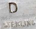 D hallmark on Indian jewelry for Calvin Desson Navajo silversmith
