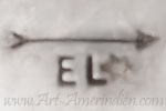 EL under an arrow mark on concho belt