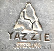 LY inside a arrowhead mark and YAZZIE stamped.