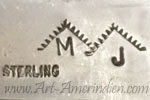 MJ under mountains symbol mark is Mark Jimenez Apache/comanche silversmith