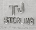 TJ misaligned initials mark