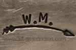 W.M. over arrow mark for Wilbur Musquet Navajo indian native american